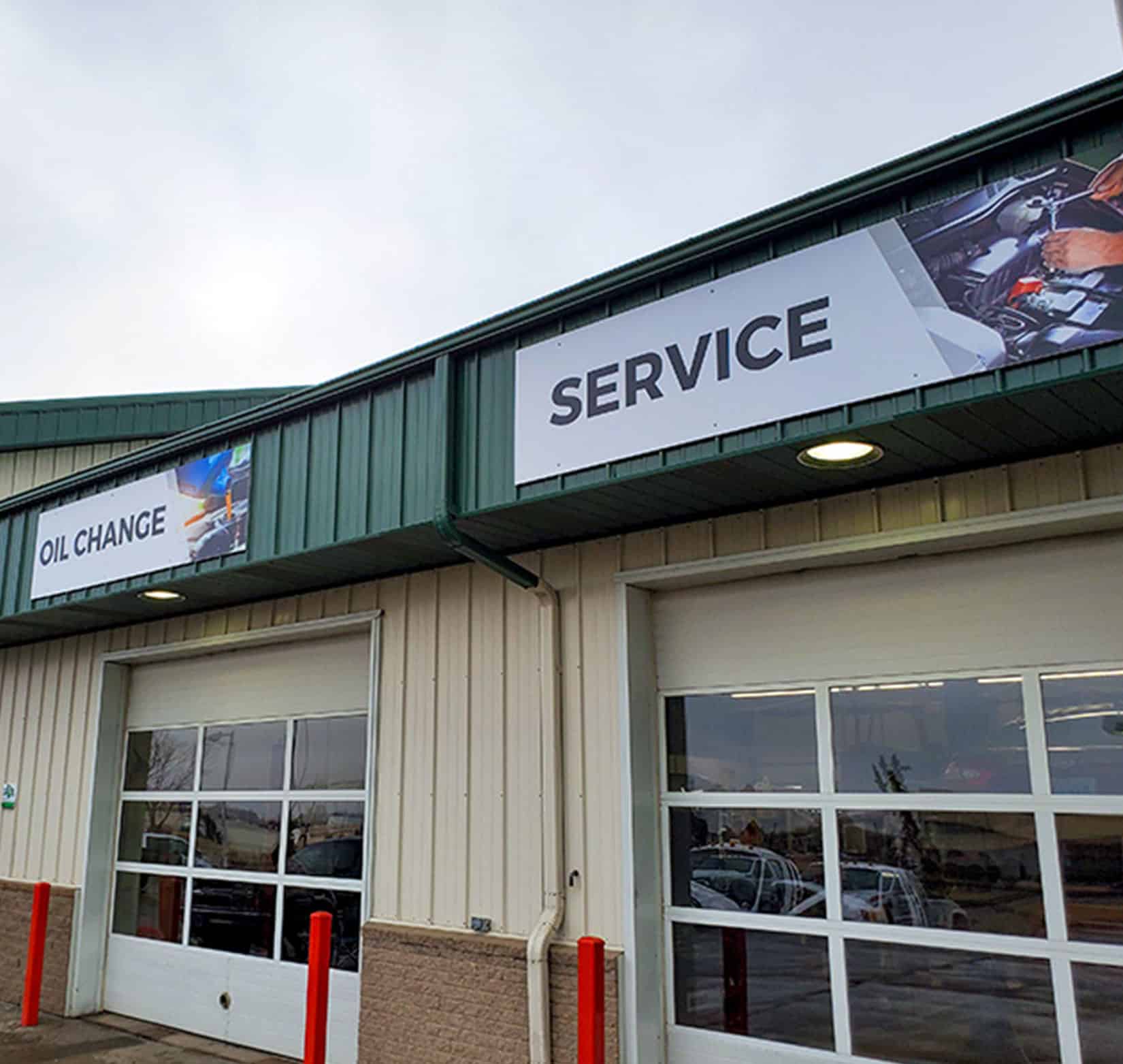 Signage outside the Dusterhoft Family Stores auto service department to designate the oil change and service areas.