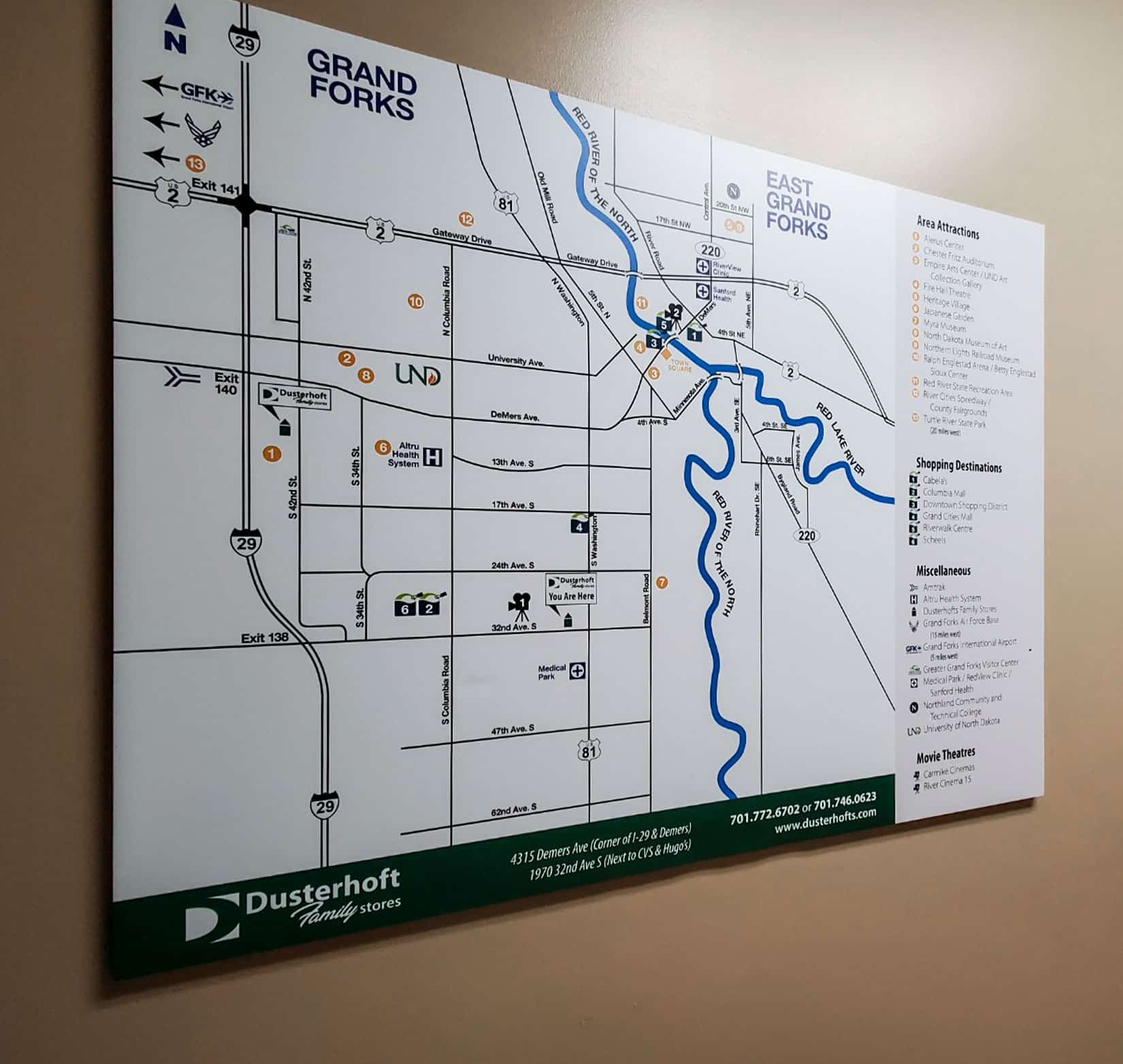 An interior sign of a Grand Forks map at Dusterhoft Family Stores