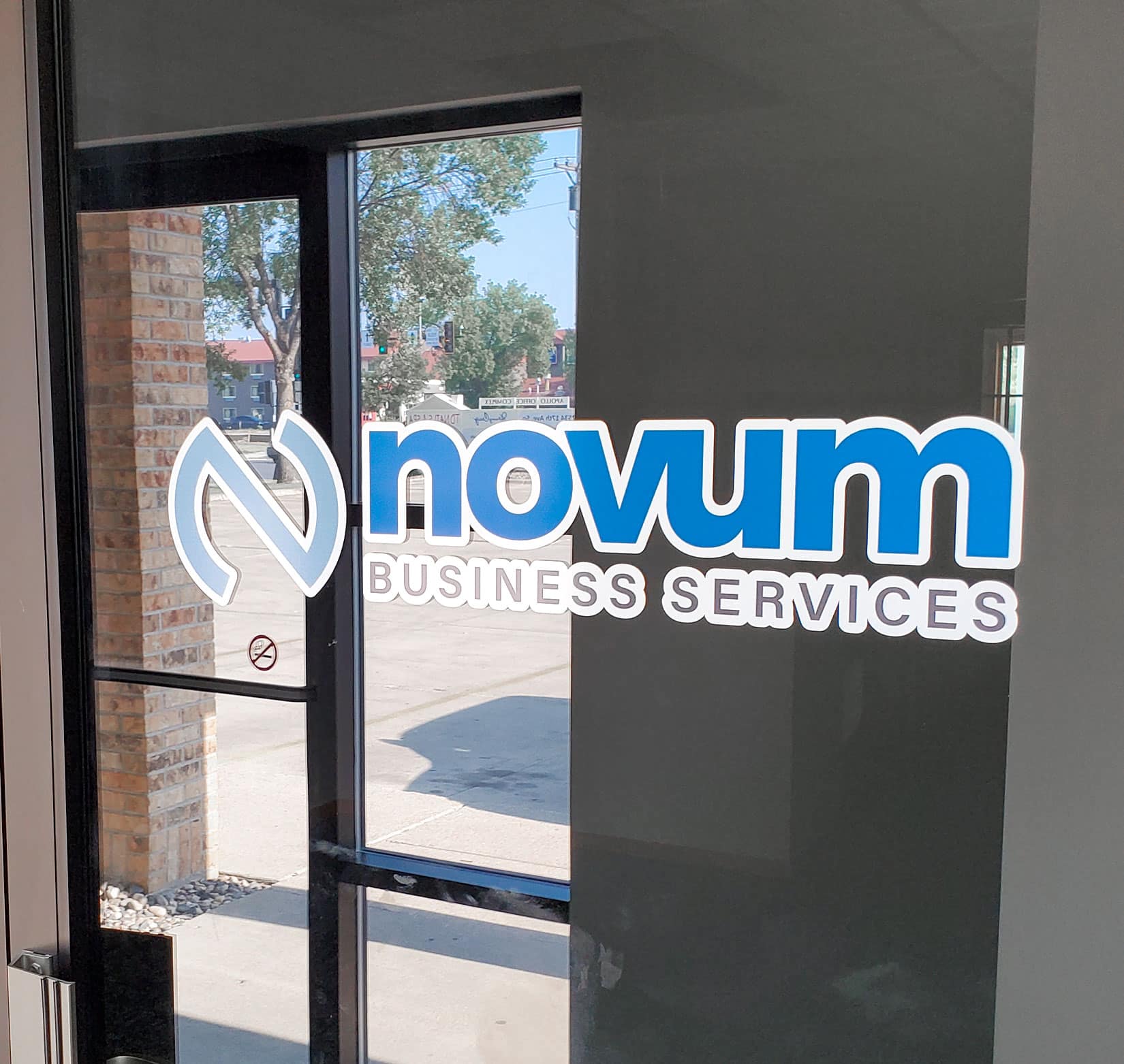 An exterior vinyl window sign for Novum Business Solutions